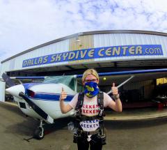 Dallas Skydive Center - Two thumbs up in front of the hangar.