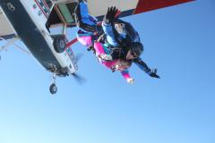 Skydivers jumping out of the plane.