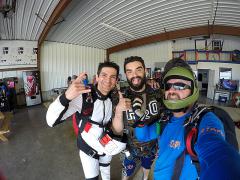 Dallas Skydive Center staff and customers take a picture.