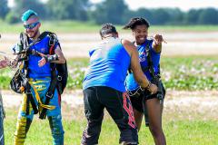 A happy women moments after landing on the ground.