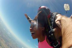 A women smiles in free fall.