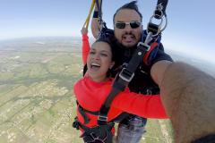 Skydivers with Lake Ray Hubbard in the background.