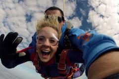 A women smiles for the camera 10,000 over Caddo Mills.