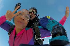 Dallas Skydive Center - A woman strikes a pose for the camera in free fall.