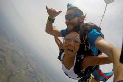 Tandem jumpers free falling at 120 miles per hour.