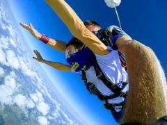 Skydiving thousands of feet above the clouds.