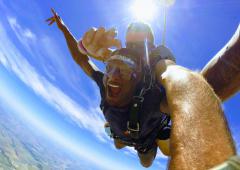 A man smiling at 10,000 feet over Dallas.