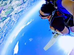 Skydivers upside down seconds after they jump from the plane.