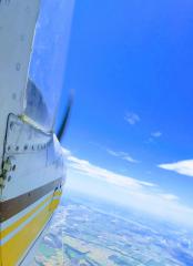 Looking out the cabin door of the Cessna.