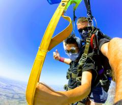 Tandem jumpers steering their chute.