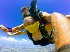 Sky diver\\\'s arms out at 10,000 feet.