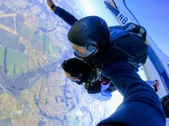 Tandem jumpers moments after they leave the plane.