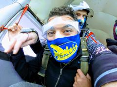 Skydivers inside the plane.