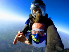 Skydivers looking at the Dallas Skyline.